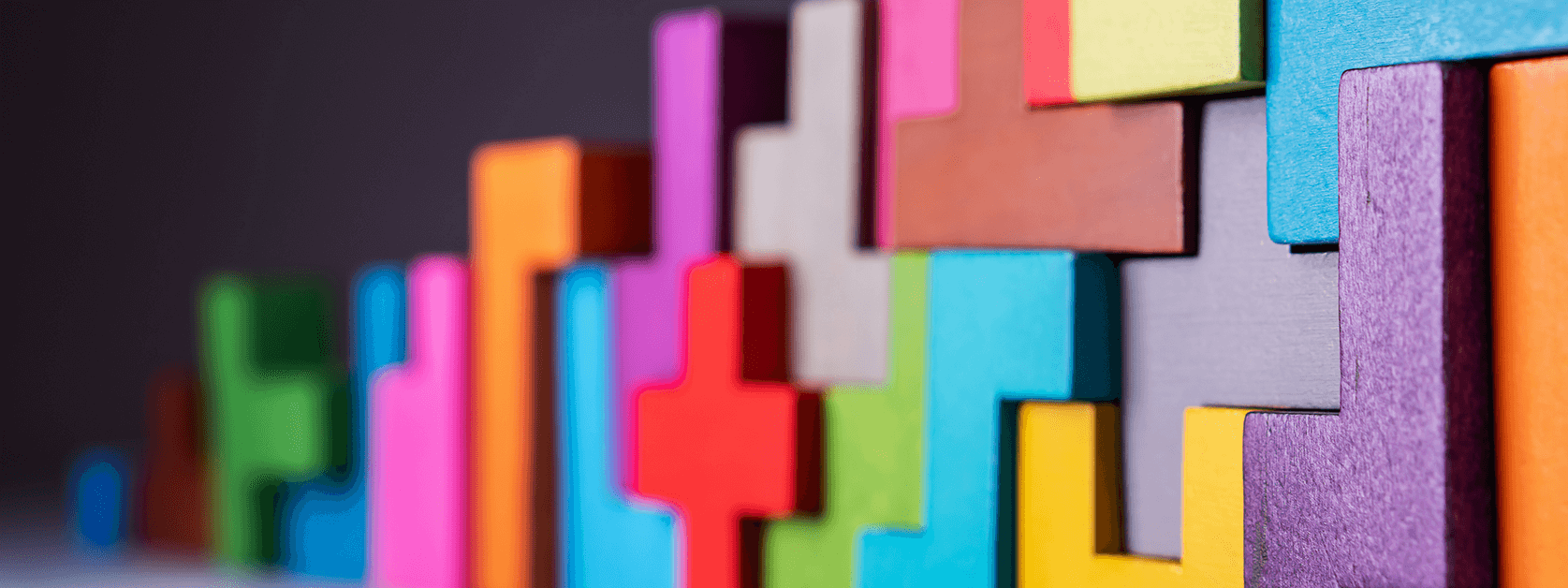 Puzzle piece building blocks that represent how AerieHub partners with their clients